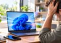 Frustrated Man Facing Laptop Startup Swirl